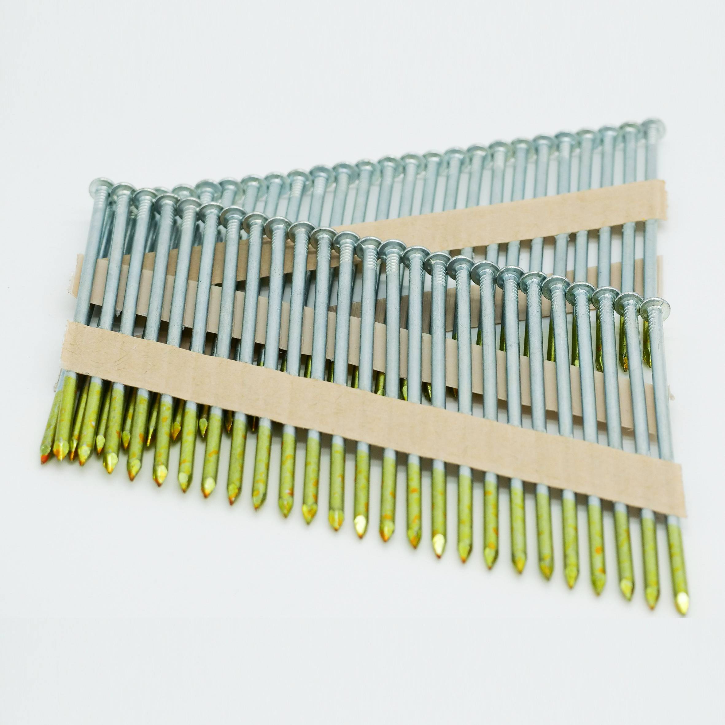 Bundle of long silver nails with yellow tips, held together by two cardboard strips on a white background.