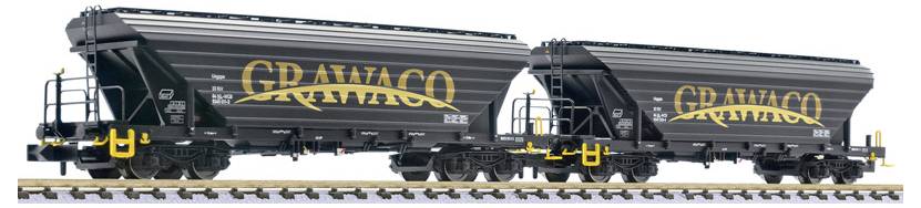 Two black GRAVACO hopper railcars on tracks, shown side by side, with yellow lettering and gray roofs.