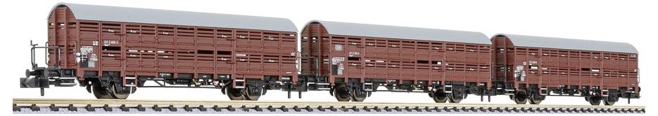Three brown freight boxcars connected in a row, shown side view on a white background.