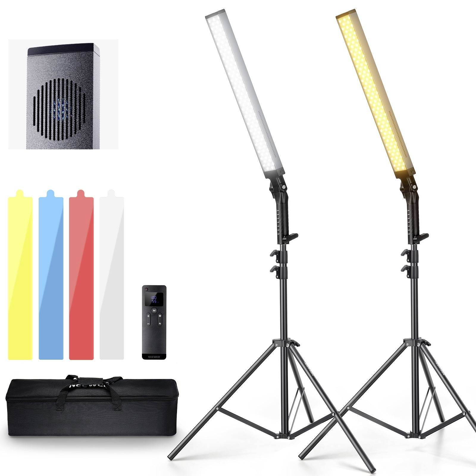 Two LED panel lights on tripods with power adapter, color filters, remote, speaker-like unit, and carrying case; lighting kit components.
