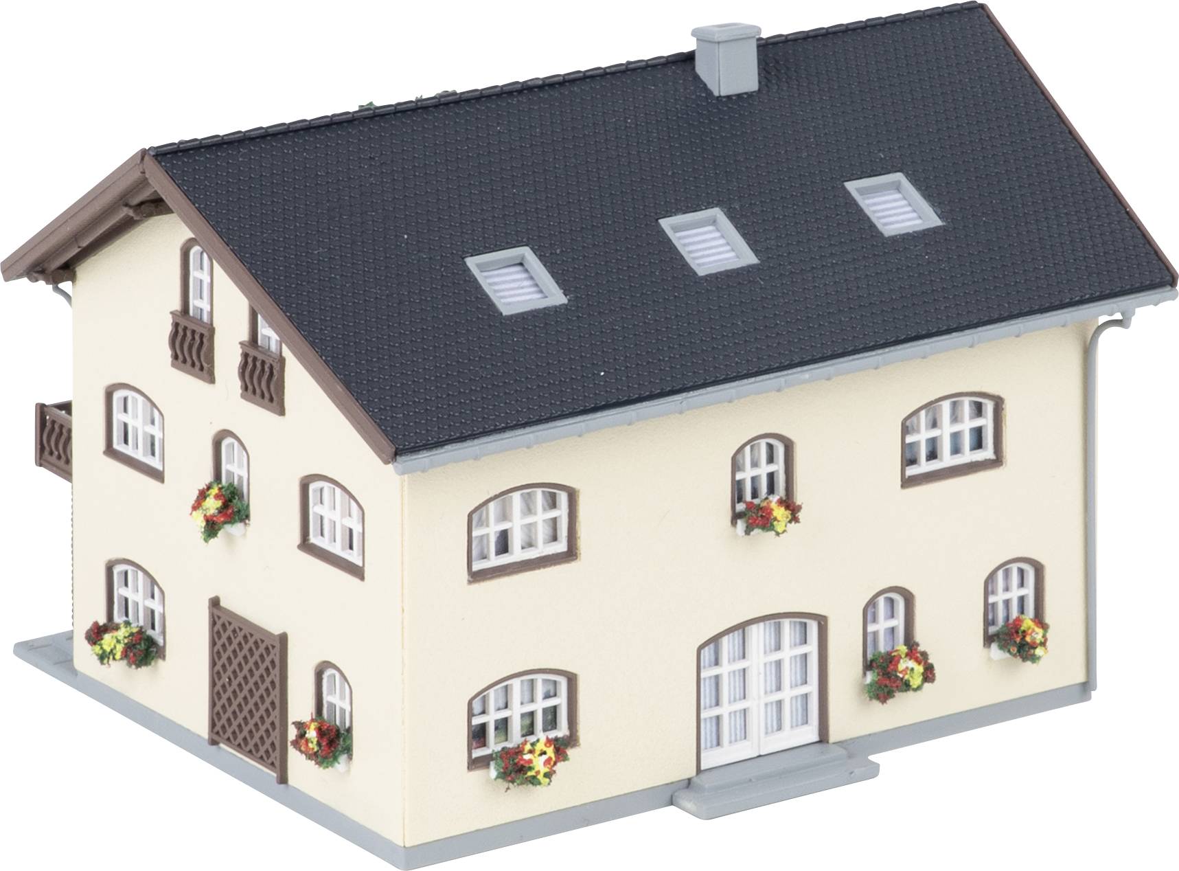 Model of a cream-colored house with dark roof, multiple windows, flower boxes, and a central front door on a white background.