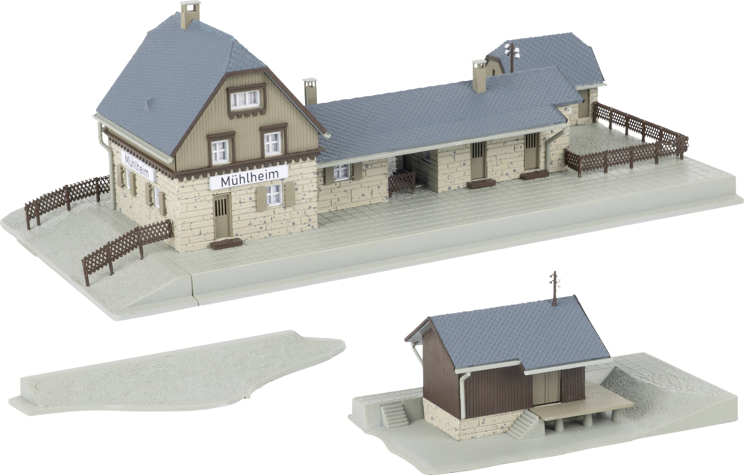 Model train station building labeled 'Mühlheim' shown in three views, including the main station model and two separate platform or annex pieces.