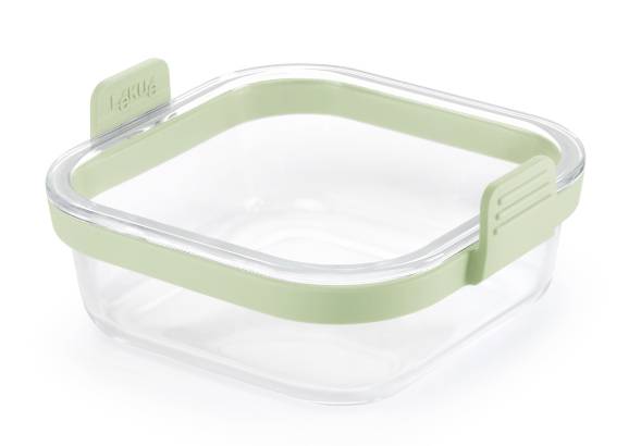 Clear square glass food container with a light green snap-on lid and seal tab, shown empty on a white background.