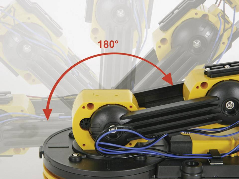 Industrial robotic arm in yellow and black rotating 180 degrees. Arrow indicates direction of movement. Cables and mechanical components visible.