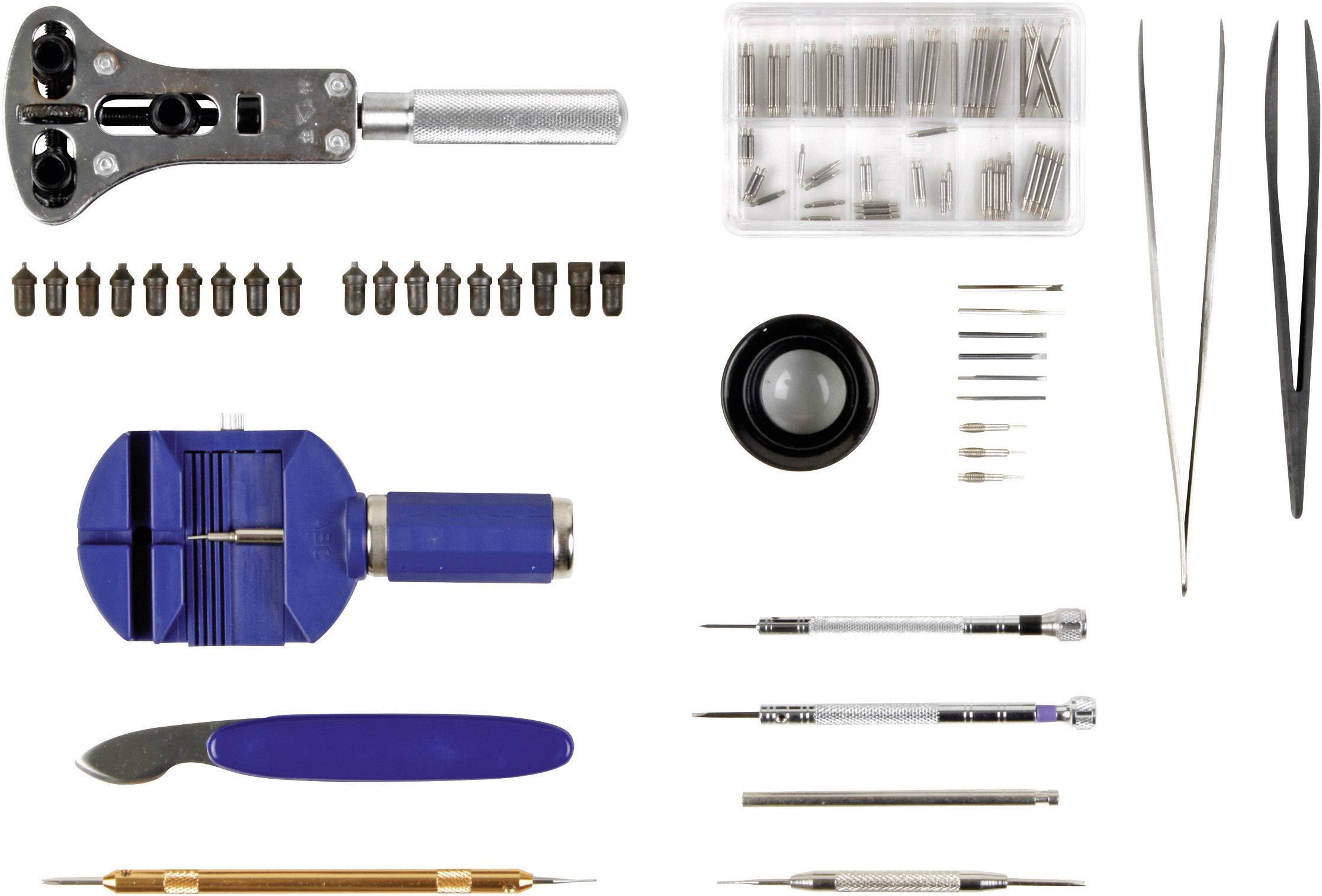 Watchmaker's tool set comprising a watch opener, miniature clamps, screwdrivers, magnifying glass, tweezers, and small precision tools.