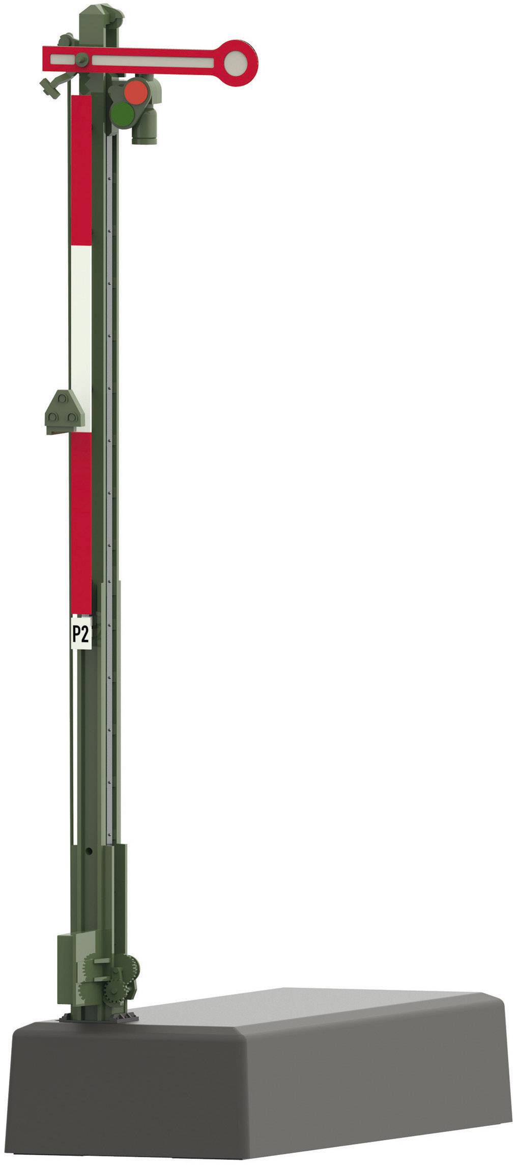 A railway signal with a red arm in a horizontal position mounted on a sturdy base.