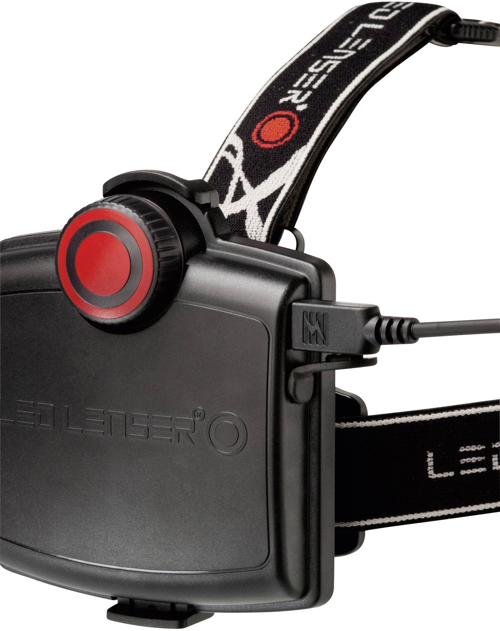 Black LED Lenser head torch with red circle on the battery box and USB connection. Suitable for outdoor activities in darkness.