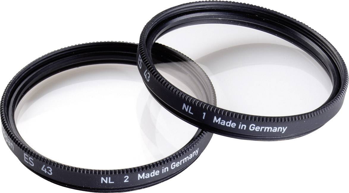 Two dark camera filters lying side by side, with the inscription 'Made in Germany'.