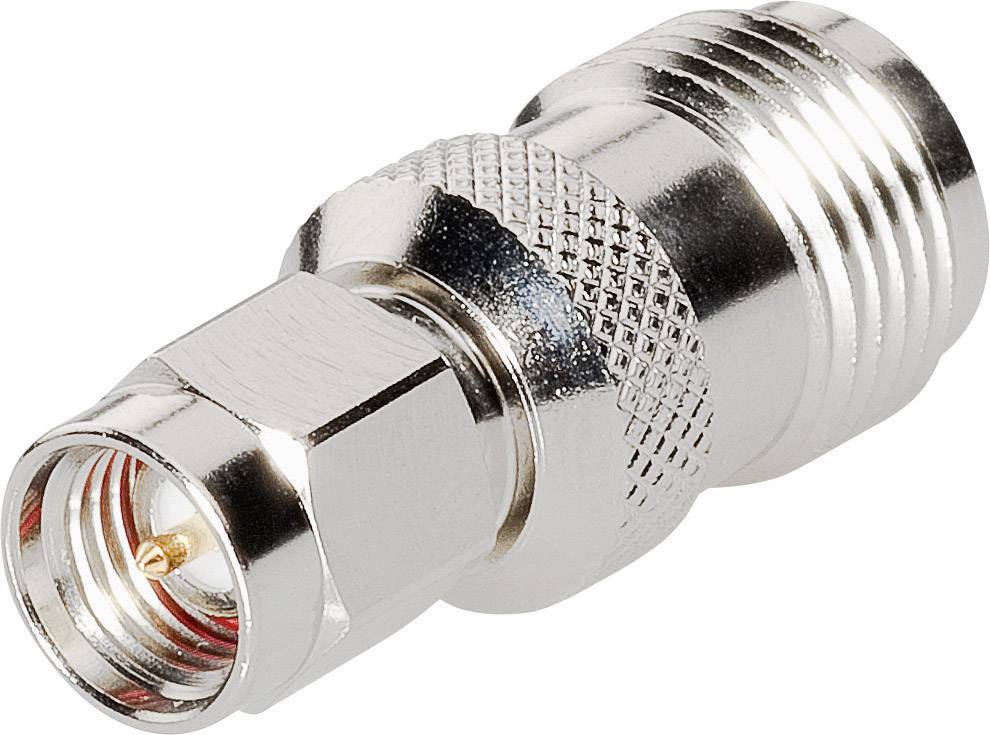 A silver adapter with a hexagonal nut and a ribbed surface, suitable for coaxial cable connections in telecommunications.