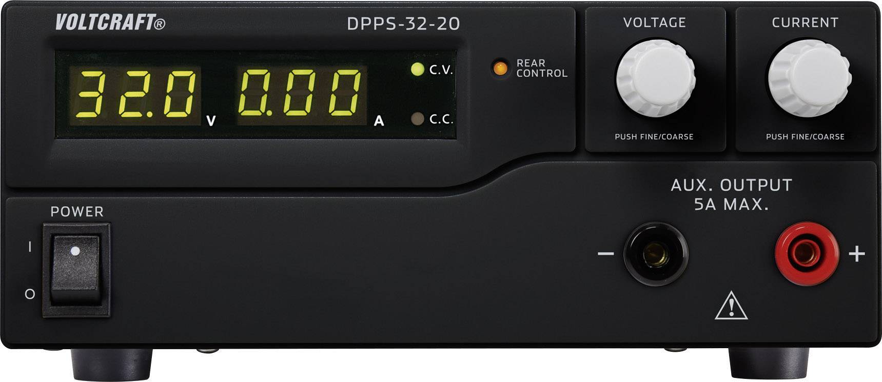 A black power supply with a digital display shows '32.0 V' and '0.00 A'. It has rotary knobs for voltage and current, along with a mains switch.