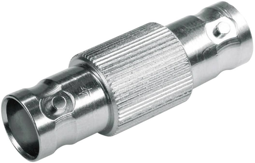 Metallic coaxial adapter with a ribbed surface, cylindrical in shape, suitable for connecting cables in electronic devices.