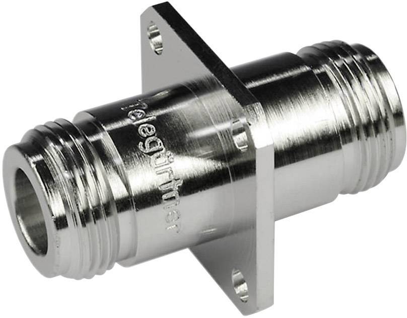 Metallic coaxial plug with flange, suitable for high-frequency applications. Knurled surface for improved grip.