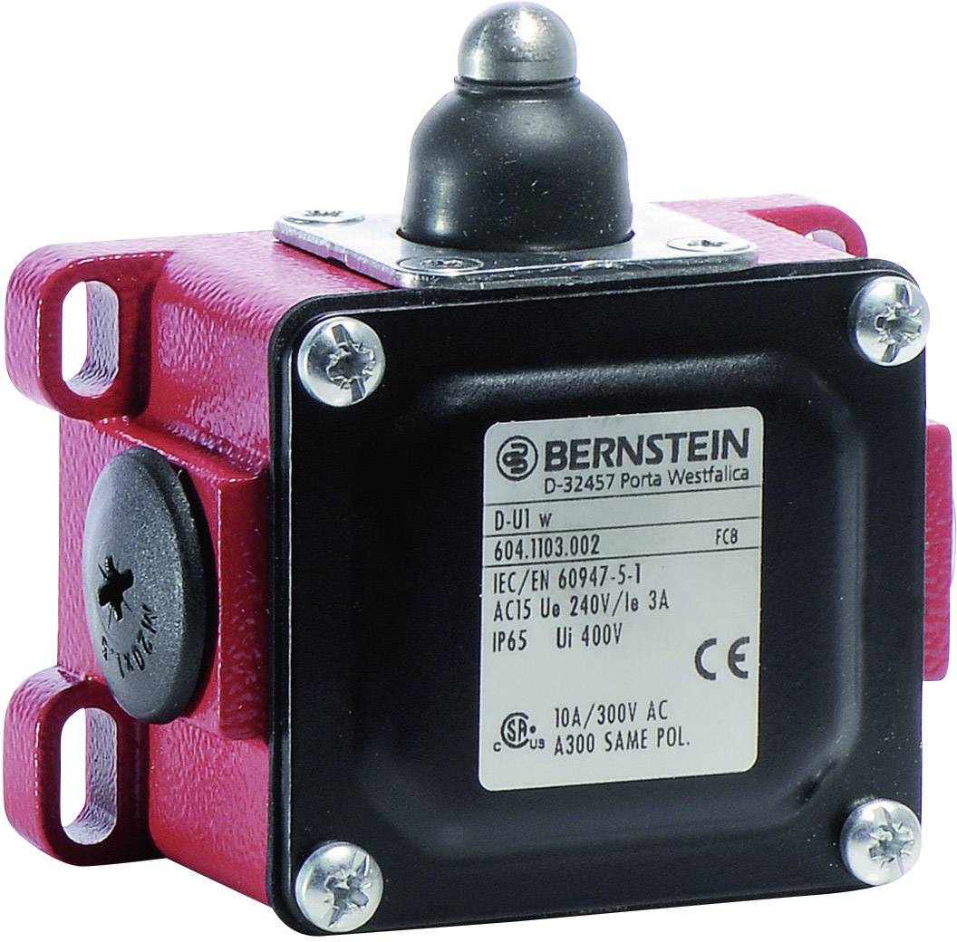 Push-button enclosure with a black button, red edges, and label with technical specifications and CE marking.