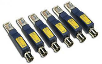 Six blue network cable testers with yellow labels, numbered from 1 to 6, lie parallel next to each other on a white surface.