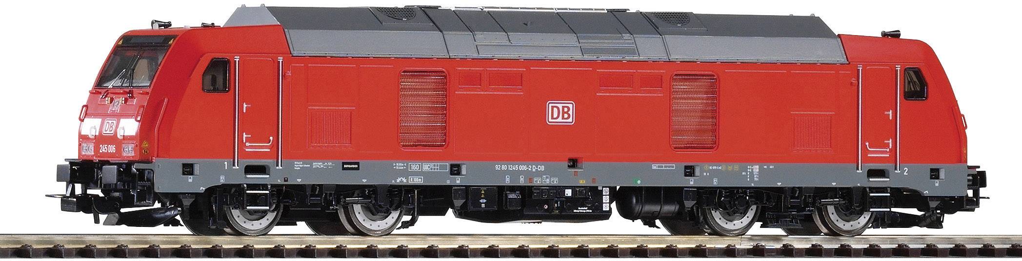 Red model electric locomotive of Deutsche Bahn on track, side view.