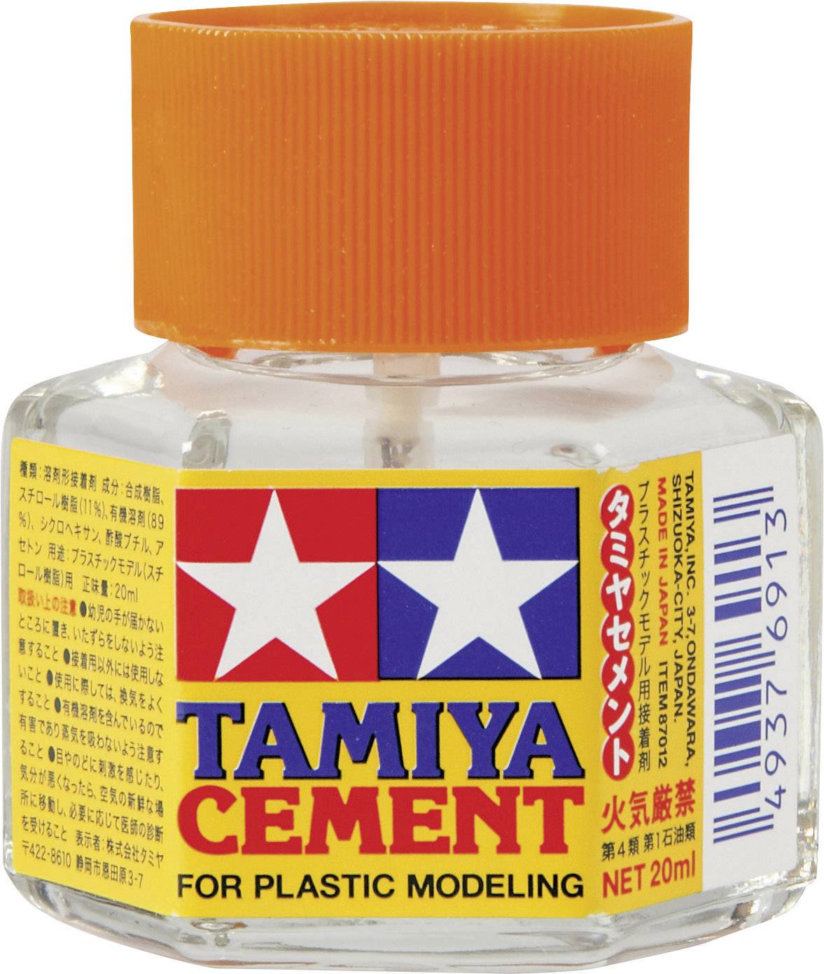 A small glass bottle with an orange screw cap. On the label it reads 'Tamiya Cement for Plastic Modelling'.Note: I changed 