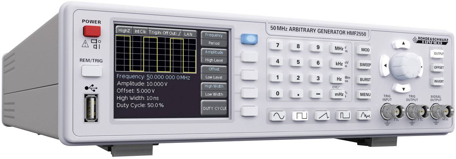 An arbitrary waveform generator with a digital display shows parameters such as frequency and amplitude. Control knobs are located to the right of the display.