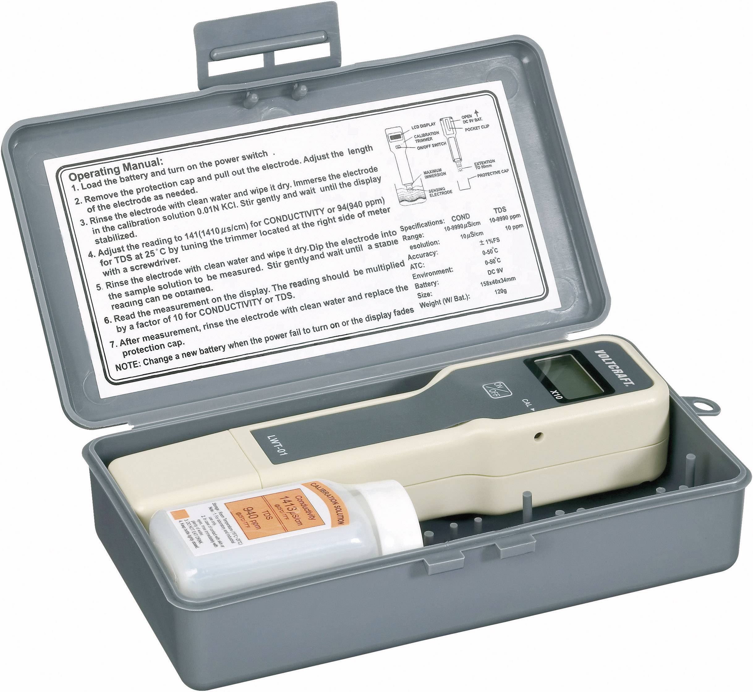 An open suitcase-style case with a digital measuring device and a bottle of calibration solution. Operating instructions attached to the case lid.