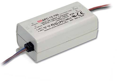 A white electric power supply with the inscription 'Mean Well APC-12-700'. It has cables at both ends and several technical symbols.