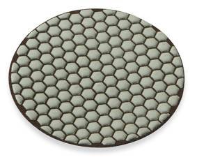 Hexagonal tile pattern in visible structure on a circular surface, reminiscent of a honeycomb.