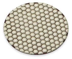 Circular disc with a honeycomb-like pattern reminiscent of bee cells, set against a white background.
