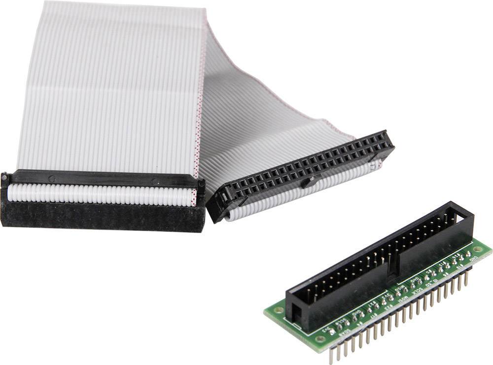 Flat ribbon cable adapter with green printed circuit board and two black connectors, enabling modular electronic interconnection.