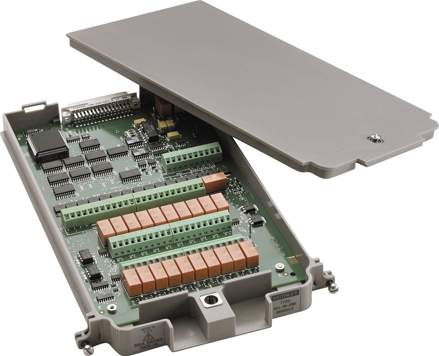 Opened electronic enclosure with visible circuit board, populated with integrated circuits, connectors, and orange and green components.