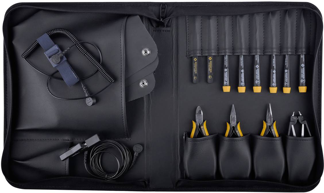 A tool set comprising screwdrivers, pliers and other small tools in a black bag.
