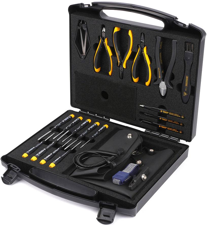 An open toolbox, filled with a variety of tools such as screwdrivers, pliers and tweezers, resting on black foam.