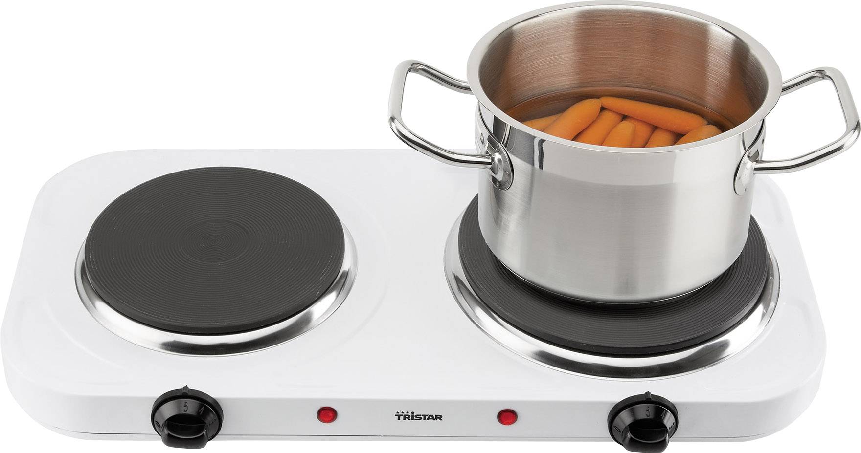 A white electric double oven with a pot full of carrots on the right hob.
