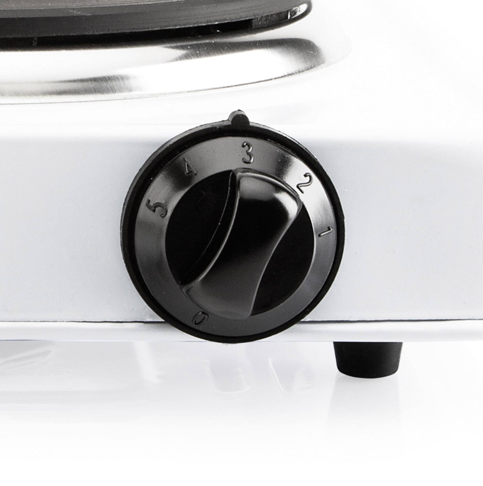 Black rotary dial on an electric cooker with five settings.
