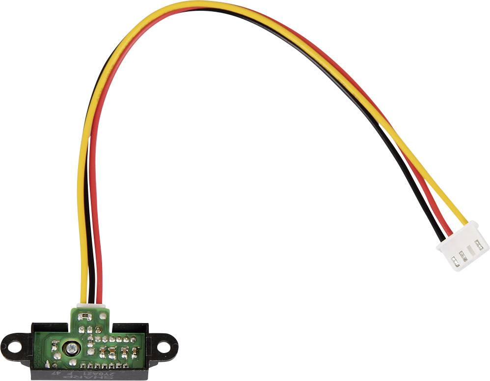 Electronic circuit board with cables in red, yellow, and black, leading to a white connector. Main component of a sensor.