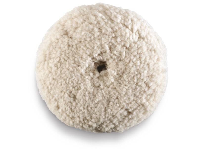 A round, white polishing pad made of sheep's wool with a fluffy texture, used for surface polishing and enhancing gloss.