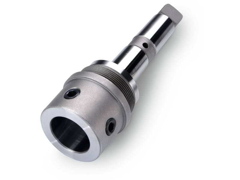 A metallic machine part with a cylindrical shape and multiple openings, shown against a white background.