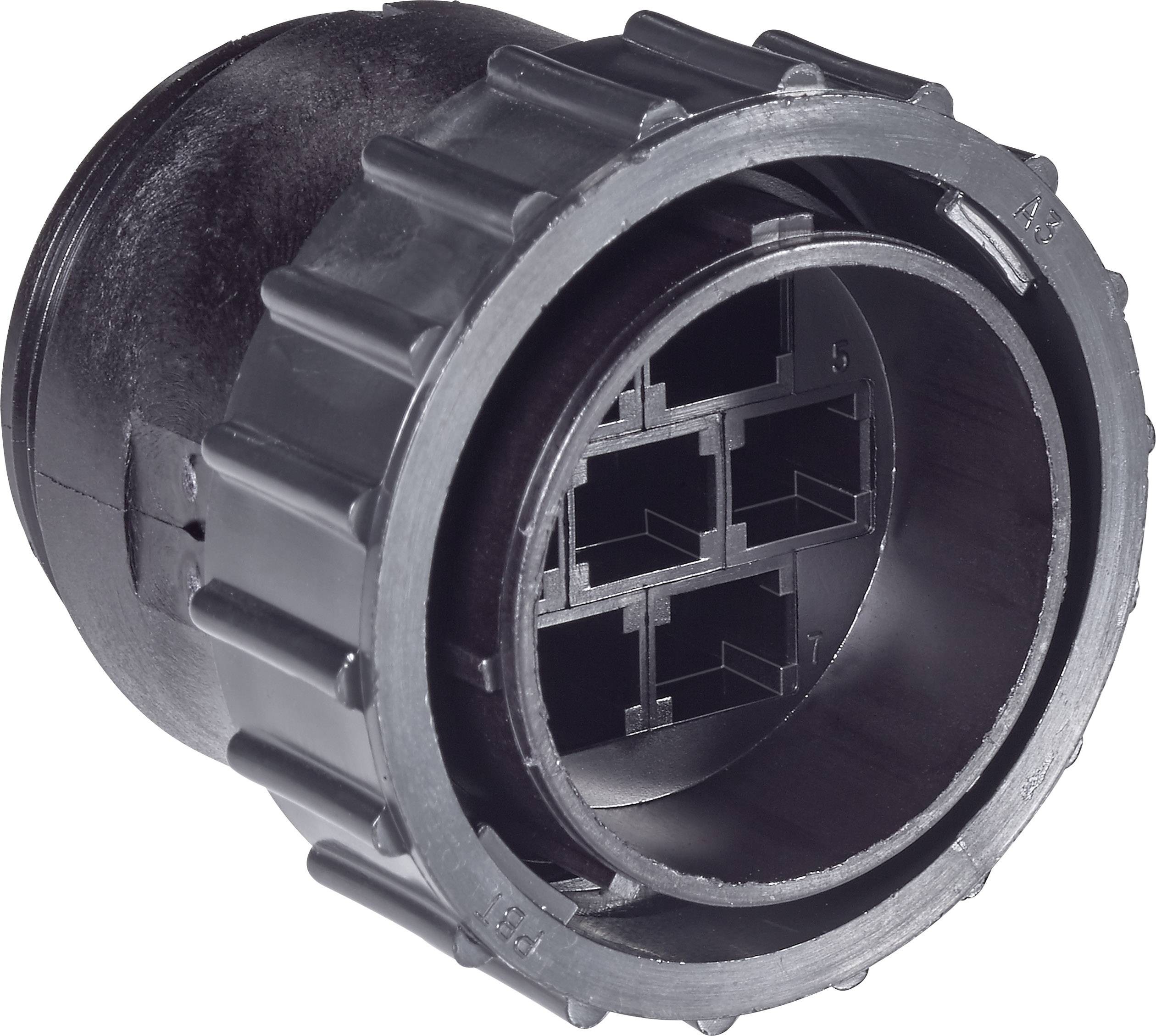 Black, cylindrical plastic component with a ridged edge and internal structure, likely an electrical or mechanical adapter.