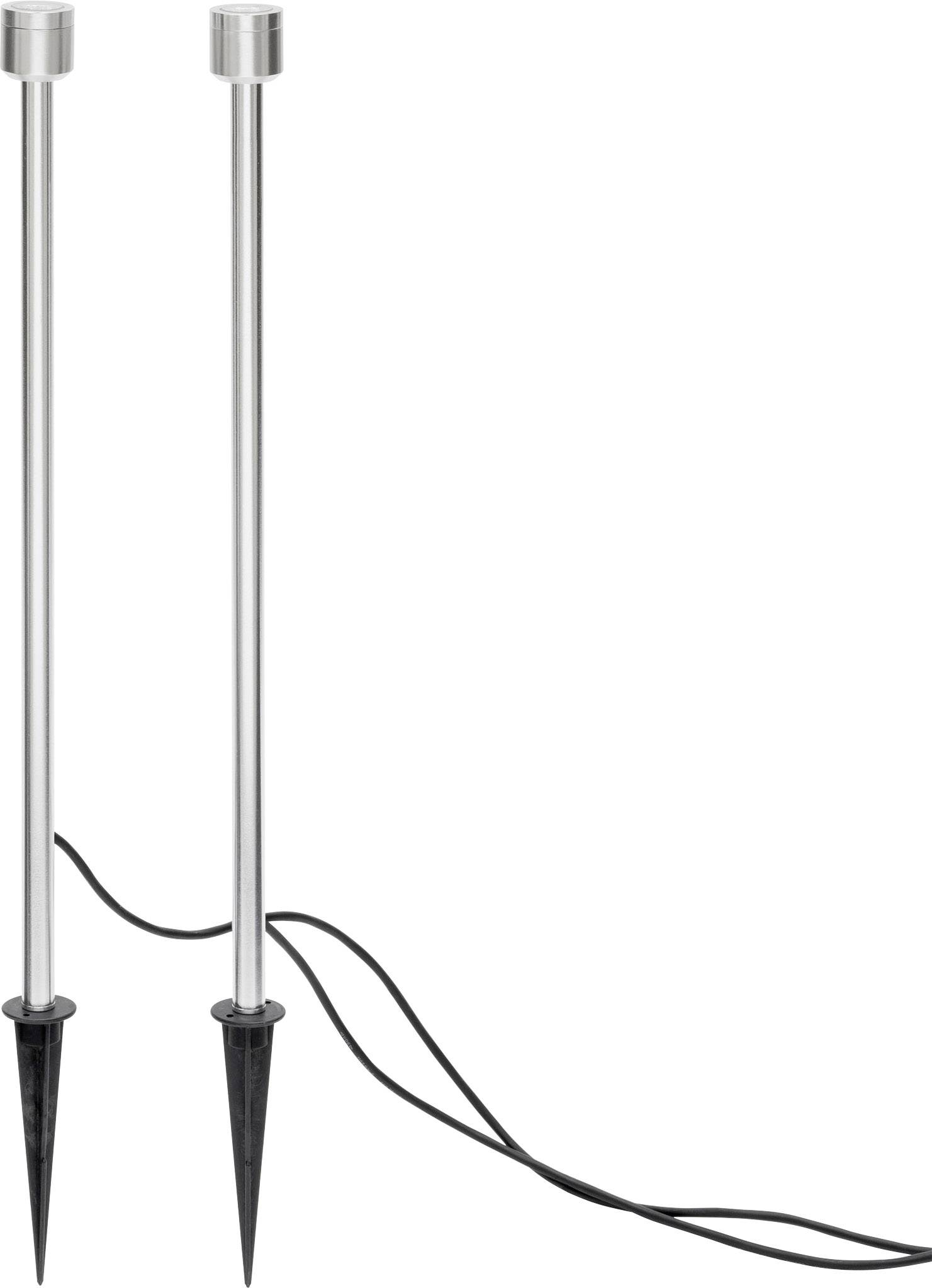 Two slender metal rods with black ground stakes and connected cables, likely for outdoor lighting purposes.