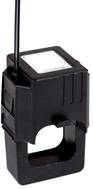 A black, rectangular electrical current sensor with cable, suitable for energy monitoring in electrical systems.