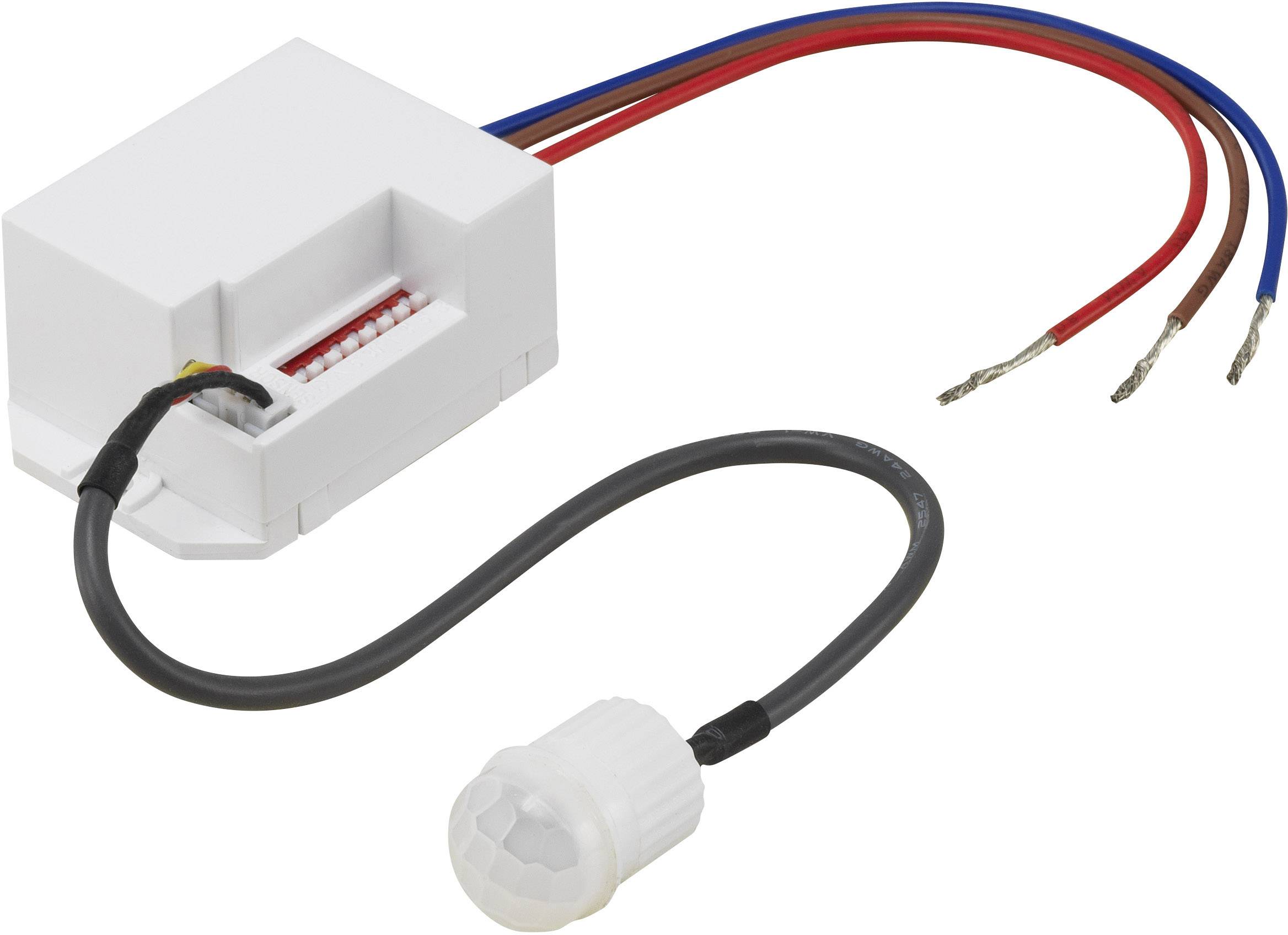 A white motion sensor with red and blue wires, along with a black cable and plug, used for electrical installations.