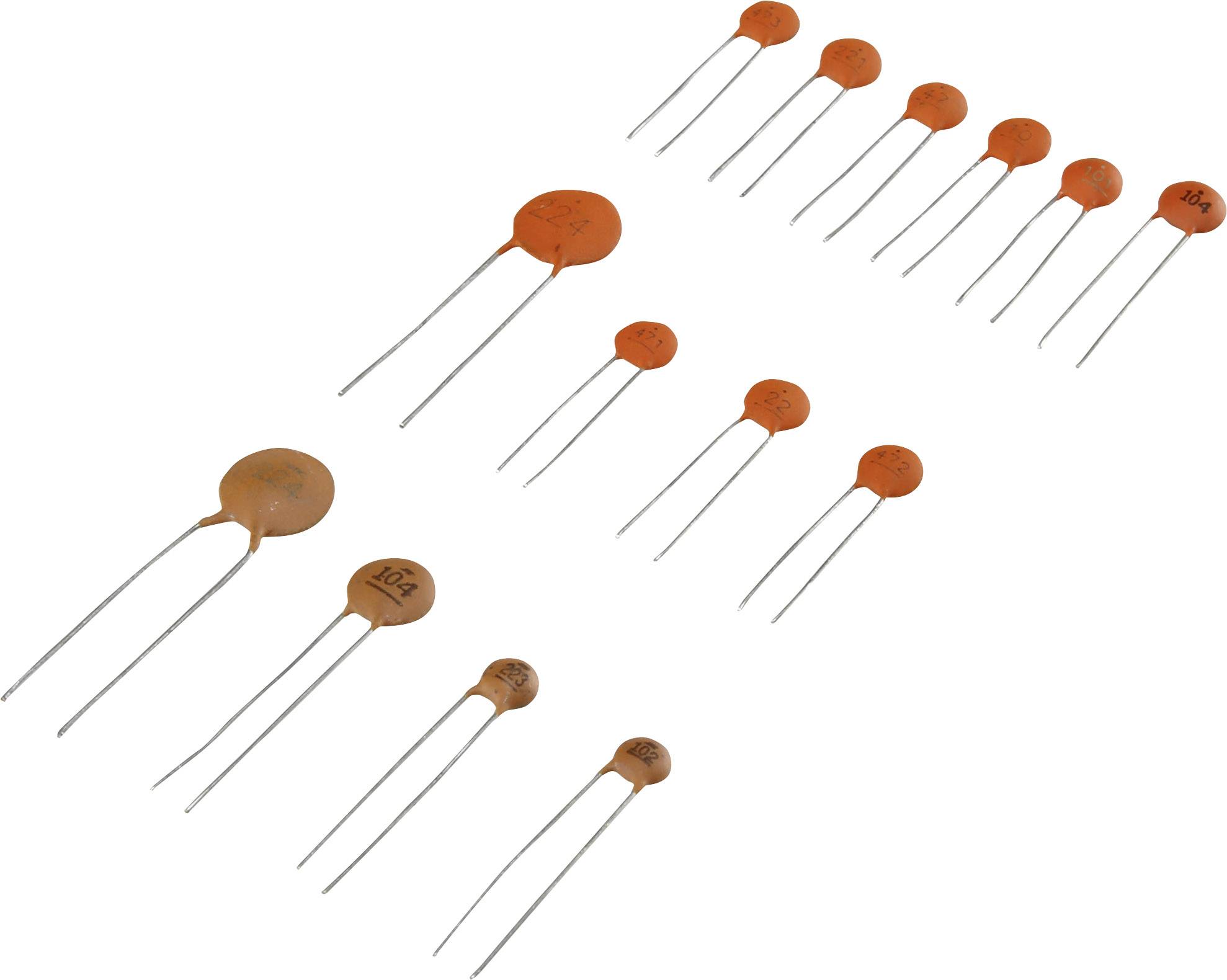 Eleven orange, round capacitors with two wire connections in various sizes and labels, arranged side by side.