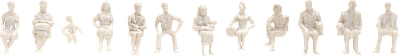 Twelve white figures sit in a row, each in different poses and sizes.