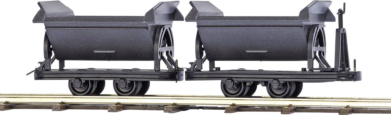 Two black open-topped goods wagons are standing on a section of railway track. The wagons are suitable for transporting loose material.