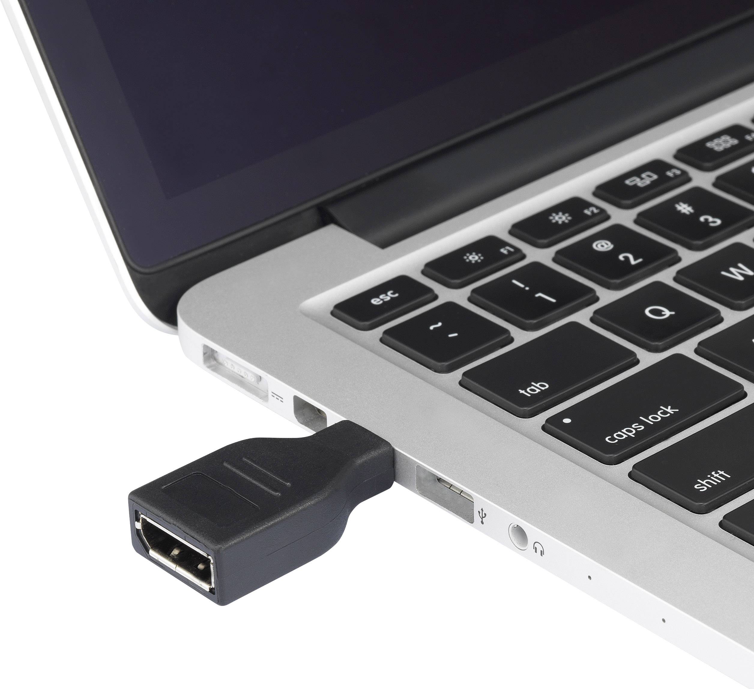 A USB cable is plugged into the side of a laptop. It shows a close-up of the keyboard and USB port.