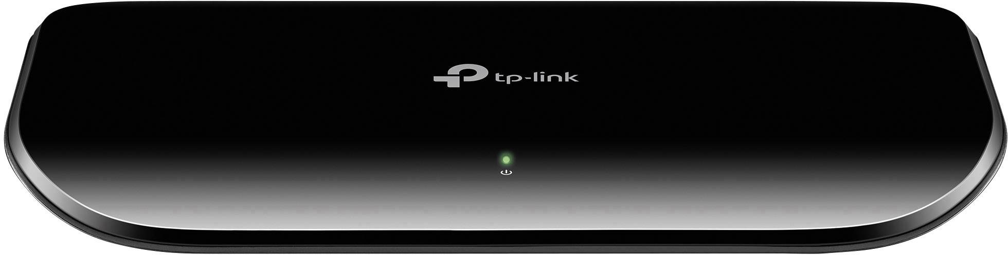 A black TP-Link network switch with a green illuminated LED indicator on the front, suitable for connecting multiple devices.