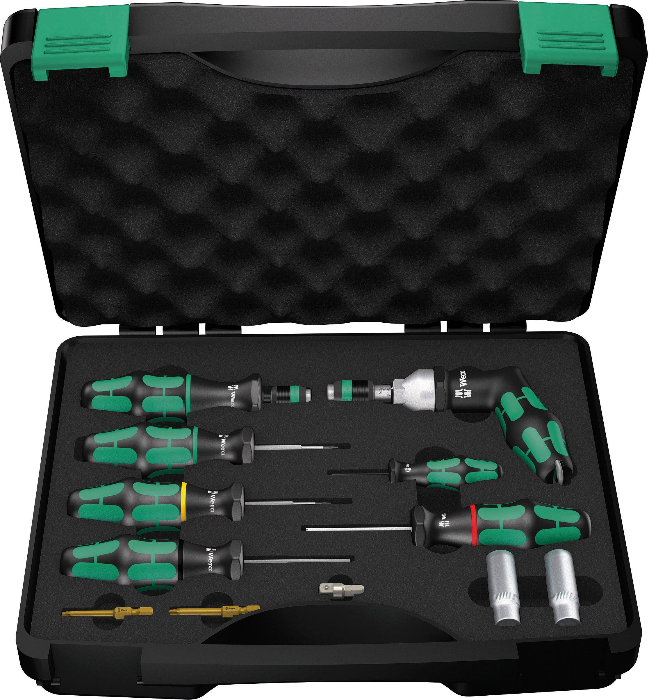 Black and green screwdriver set in an opened case with various bits and handles, organised in a foam insert.