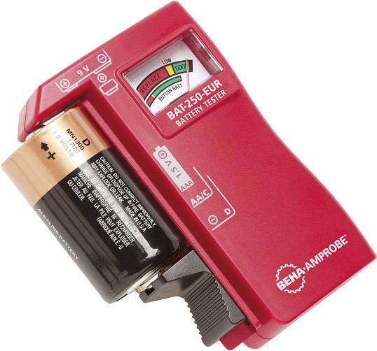 A red battery tester from the brand BEHA-AMPROBE is measuring the charge level of a D-cell battery. The display shows a green area indicating a fully charged state.