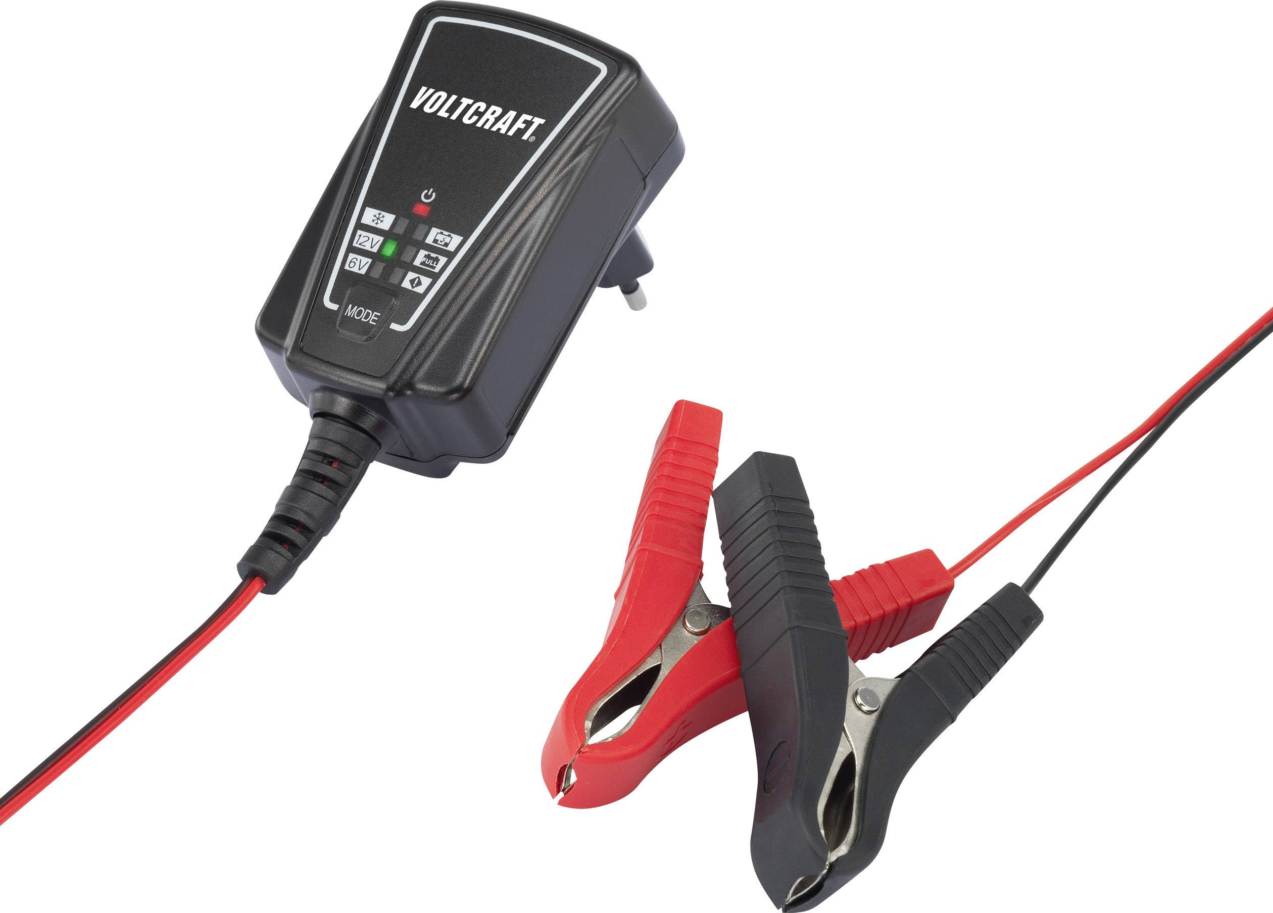 A Voltcraft battery charger with a power cable and two colour-coded clips, red and black, for connecting to battery terminals.