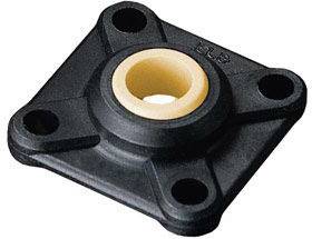 Quadratic black storage housing with four mounting holes and a central white bushing in the centre.