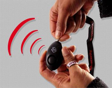 Two hands are holding a small, black alarm device. Red wavy lines indicate an acoustic signal or alarm.