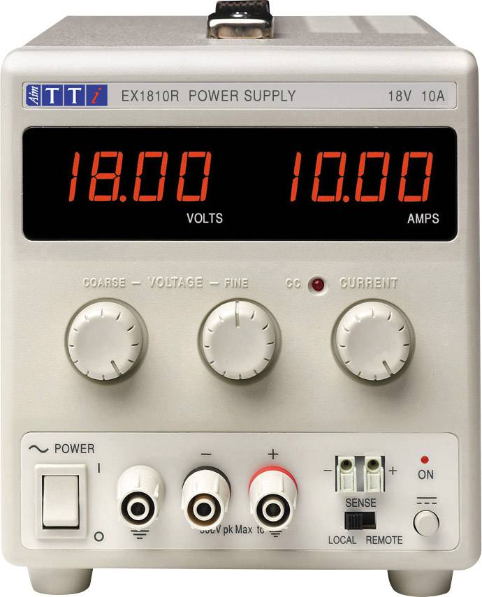 A laboratory power supply with digital displays shows a voltage of 18.00 volts and a current of 10.00 amperes.