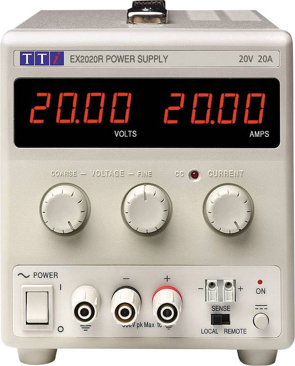 Laboratory power supply with digital display shows '20.00 VOLTS' and '20.00 AMPS'. Adjustment knobs for voltage and current present.